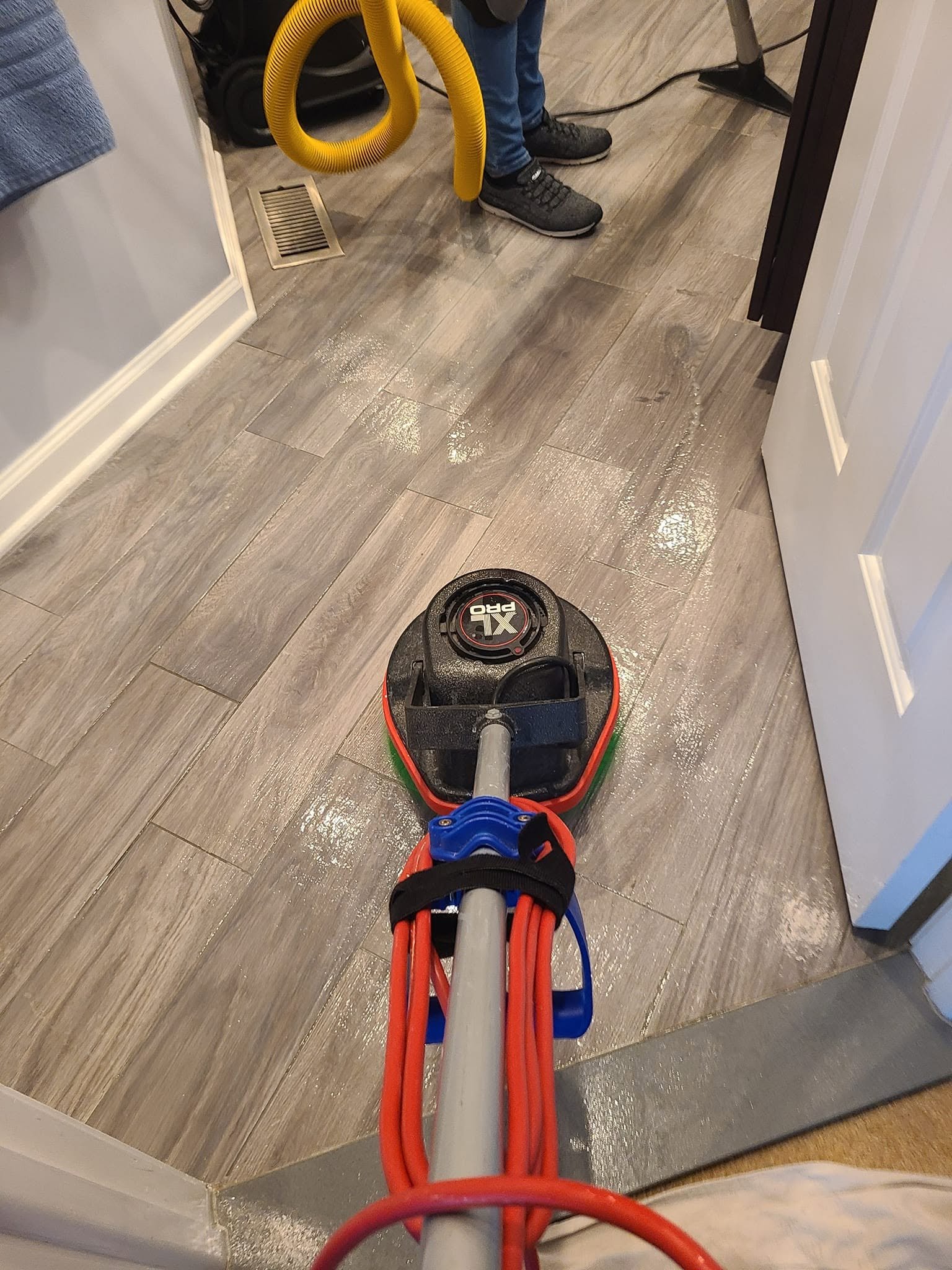 Vinyl plank floor cleaning machine in use